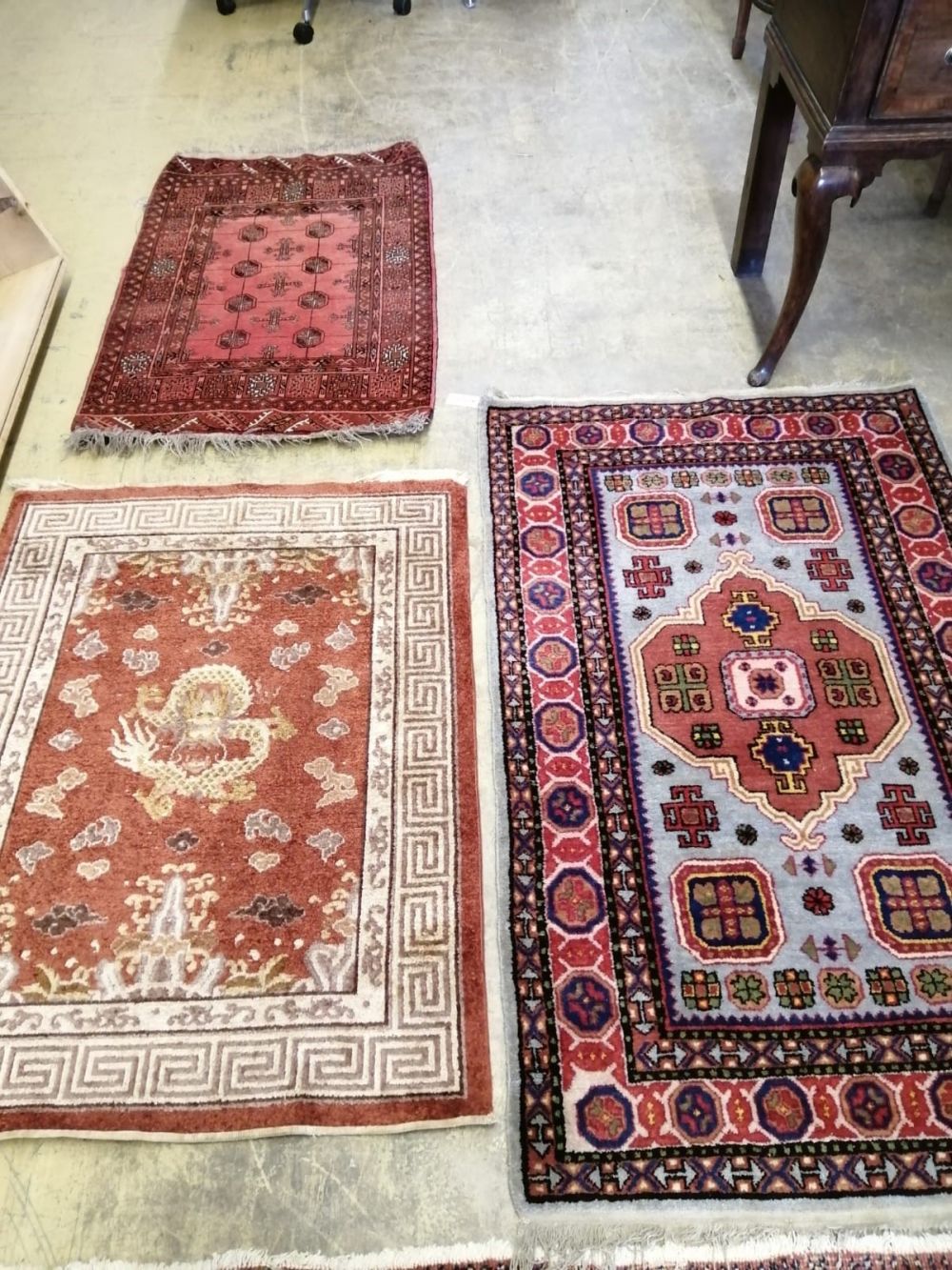 A Caucasian design rug, 150 x 94cm together with a smaller Chinese rug and a small Bokhara rug